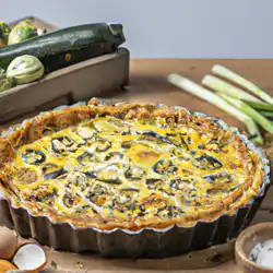 Une image de Quiche Savoyarde des Jardins: Pâte Sablée, Oeufs, Gruyère en Petits Morceaux, Fromage de Chèvre, Poireau, Courgettes - image générée par IA (DALL-E)