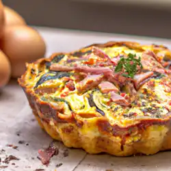 Une image de Quiche provençale à la pâte à pizza, au jambon, au fromage de chèvre et aux courgettes - image générée par IA (DALL-E)