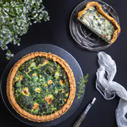 Une image de Quiche au fromage de chèvre, épinards et pâte à pizza, inspirée de la région de Provence - image générée par IA (DALL-E)